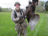 Jeff holding up turkey he shot
